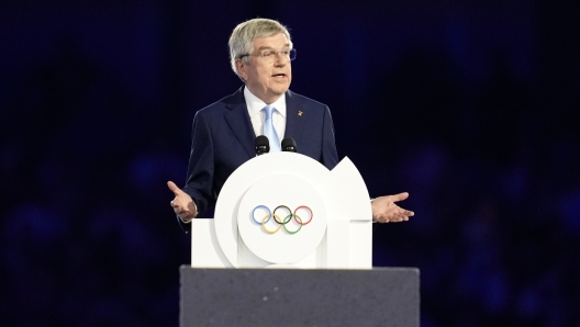 IOC President Thomas Bach addresses the audience during the 2024 Summer Olympics closing ceremony at the Stade de France, Sunday, Aug. 11, 2024, in Saint-Denis, France. (AP Photo/Ashley Landis)