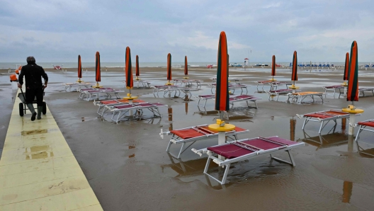 Heavy rainfalls flooded the Lido of Rimini where private beaches are closed due to bad weather on the adriatic coastline of Italy, on September 19, 2024. The strong winds and rains which have swept across central and eastern Europe, killing 24 people, pummeled the Emilia-Romagna and Marche regions, with over 1,000 people evacuated from homes. (Photo by Andreas SOLARO / AFP)