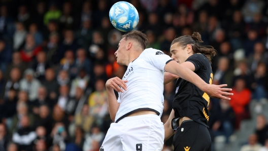 Spezia's Francesco Pio Esposito jumps for the ball with Sampdoria's Daniele Ghilardi during the Serie BKT soccer match between Spezia and Sampdoria at the Alberto Picco stadium in La Spezia, Italy - Monday, April 20, 2024 - Sport  Soccer (Photo by Tano Pecoraro/LaPresse)