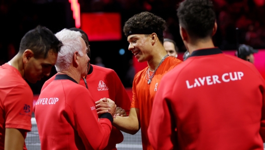 BERLIN, GERMANY - SEPTEMBER 21: Ben Shelton of Team World celebrates after winning match point with John McEnroe, Captain of Team World, against Casper Ruud and Stefanos Tsitsipas of Team Europe during the Men's Doubles match on day two of the Laver Cup at Uber Arena on September 21, 2024 in Berlin, Germany.  (Photo by Clive Brunskill/Getty Images for Laver Cup)