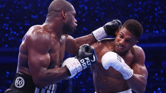 LONDON, ENGLAND - SEPTEMBER 21: Daniel Dubois punches Anthony Joshua during the IBF World Heavyweight Title fight between Daniel Dubois and Anthony Joshua, on the Riyadh Season  - Wembley Edition card at Wembley Stadium on September 21, 2024 in London, England. (Photo by Richard Pelham/Getty Images)