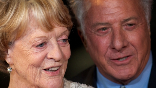 (FILES) US actor and director Dustin Hoffman (R) poses with British actress Maggie Smith (L) on the red carpet as they arrive to attend the premiere of 'Quartet' during the 56th BFI London Film Festival in London on October 15, 2012. Oscar-winning British actor Maggie Smith, a star of stage and screen for more than seven decades, died in hospital in London on Friday, September 27, her sons announced. (Photo by ANDREW COWIE / AFP)