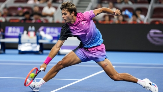 BEIJING, CHINA - SEPTEMBER 26: Flavio Cobolli of Italy plays a backhand in the Men's Singles First Round against Alexander Bublik of Kazakhstan during day four of the 2024 China Open at National Tennis Center on September 26, 2024 in Beijing, China. (Photo by Shi Tang/Getty Images)