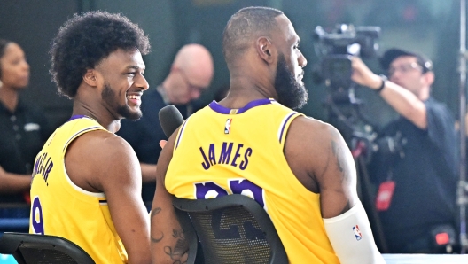 Los Angeles Lakers #23 LeBron James and his son #9 Bronny James attend the Lakers media day at UCLA Health Training Center in El Segundo, California, September 30, 2024. (Photo by Frederic J. BROWN / AFP)