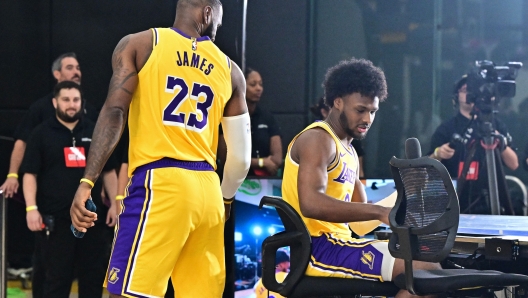 Los Angeles Lakers #23 LeBron James and his son #9 Bronny James attend the Lakers media day at UCLA Health Training Center in El Segundo, California, September 30, 2024. (Photo by Frederic J. BROWN / AFP)