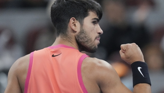 Carlos Alcaraz of Spain gestures during their men's singles finals match against Jannik Sinner of Italy at the China Open tennis tournament, National Tennis Center in Beijing, Wednesday, Oct. 2, 2024. (AP Photo/Achmad Ibrahim)