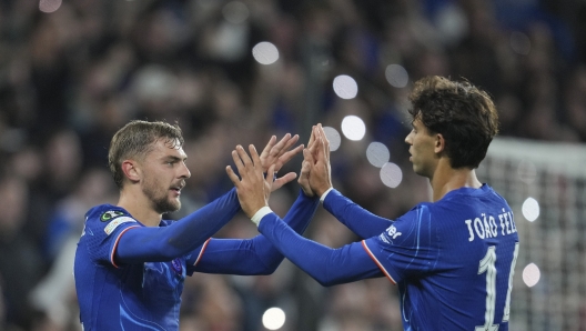 Chelsea's Kiernan Dewsbury-Hall, left, celebrates with Joao Felix after scoring his side's fourth goal during the Europa Conference League opening phase soccer match between Chelsea and Gent at Stamford Bridge in London, Thursday, Oct. 3, 2024. (AP Photo/Kin Cheung)