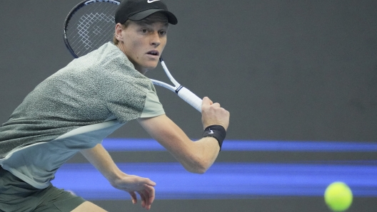 Jannik Sinner of Italy plays a backhand return against Carlos Alcaraz of Spain during their men's singles finals match of the China Open tennis tournament, at the National Tennis Center in Beijing, Wednesday, Oct. 2, 2024. (AP Photo/Achmad Ibrahim)