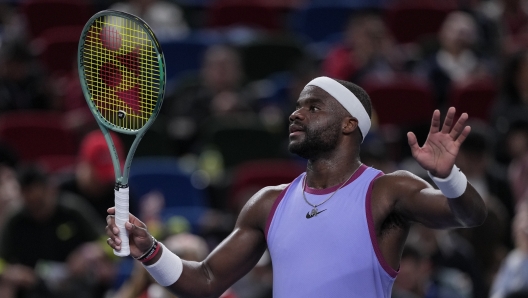 Frances Tiafoe of the United States waves to spectators after defeating Zhou Yi of China in the men's singles second round match in the Shanghai Masters tennis tournament at Qizhong Forest Sports City Tennis Center in Shanghai, China, Monday, Oct. 7, 2024. (AP Photo/Andy Wong)