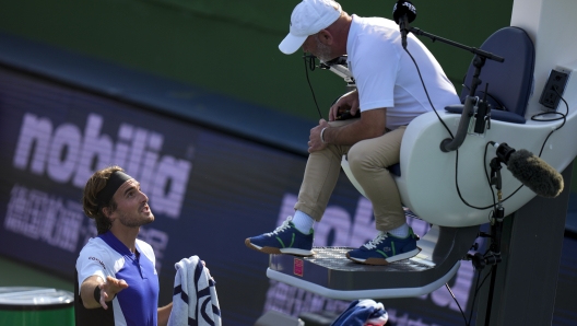 Stefanos Tsitsipas of Greece talks to an umpire during the men's singles fourth round match against Daniil Medvedev of Russia, in the Shanghai Masters tennis tournament at Qizhong Forest Sports City Tennis Center in Shanghai, China, Wednesday, Oct. 9, 2024. (AP Photo/Andy Wong)