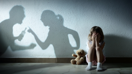 Little Girl Crying With Shadow Of Parents Arguing - Home Violence And Divorce