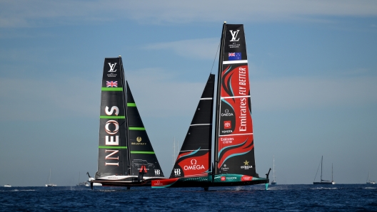 BARCELONA, SPAIN - OCTOBER 19: Crews of Emirates Team New Zealand and Team Ineos Britannia compete during the race between Emirates Team New Zealand and Team Ineos Britannia in the 37th America's Cup on October 19, 2024 in Barcelona, Spain. (Photo by David Ramos/Getty Images)