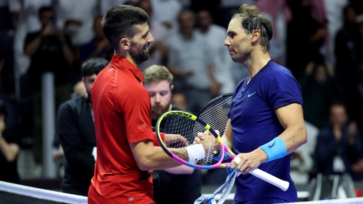 RIYADH, SAUDI ARABIA - OCTOBER 19: Novak Djokovic of Serbia (left) shakes hands with Rafael Nadal of Spain after defeating him to win the Men's Singles Third Place Playoff match on day three of the Six Kings Slam 2024 at Kingdom Arena on October 19, 2024 in Riyadh, Saudi Arabia. (Photo by Richard Pelham/Getty Images)