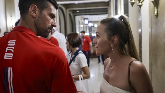 BELGRADE, SERBIA - AUGUST 12: Novak Djokovic (L) speaks with his wife Jelena Djokovic (R) during Celebration Of Serbia Olympic Team  at City hall on August 12, 2024 in Belgrade, Serbia. (Photo by Srdjan Stevanovic/Getty Images)