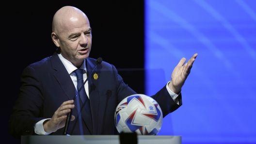 FILE - FIFA President Ganni Infantino addresses the 78th Conmebol Congress in Luque, Paraguay, Thursday, April 11, 2024. FIFA has been told to reschedule its inaugural expanded Club World Cup just over a year before the tournament is due to be hosted by America. (AP Photo/Jorge Saenz, File)