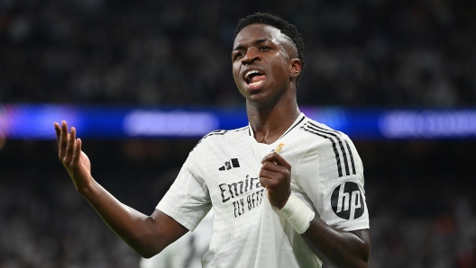 MADRID, SPAIN - OCTOBER 22: Vinicius Junior of Real Madrid celebrates scoring his team's fifth goal during the UEFA Champions League 2024/25 League Phase MD3 match between Real Madrid C.F. and Borussia Dortmund at Estadio Santiago Bernabeu on October 22, 2024 in Madrid, Spain. (Photo by Denis Doyle/Getty Images)