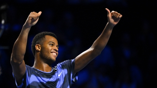 France's Giovanni Mpetshi Perricard celebrates after winning the final match of the Swiss Indoors ATP 500 tennis tournament against US' Ben Shelton in Basel on October 27, 2024. (Photo by Fabrice COFFRINI / AFP)