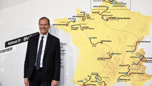 epa11690327 Tour de France General Director Christian Prudhomme poses in front of the Tour de France Men 2025 map during the presentation of the Men and Women Tour de France 2025 cycling race in Paris, France, 29 October 2024. The 112th edition of the Tour de France will start from Lille, France, on 05 July 2025 and will arrive in Paris, France, on 27 July 2025.  EPA/CHRISTOPHE PETIT TESSON