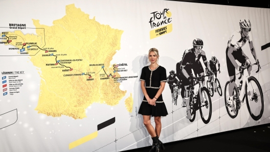 epa11690343 Women's Tour de France race director Marion Rousse poses in front of the Tour de France Femmes 2025 route map during the presentation of the Men and Women Tour de France 2025 cycling race in Paris, France, 29 October 2024.  The fourth edition of the Tour de France Femmes will take place from 26 July to 03 August 2025.  EPA/CHRISTOPHE PETIT TESSON