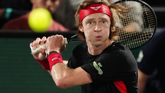 Russia's Andrey Rublev eyes the ball as he plays against Argentina's Francisco Cerundolo during their men's singles match on day two of the Paris ATP Masters 1000 tennis tournament at the Accor Arena - Palais Omnisports de Paris-Bercy - in Paris on October 29, 2024. (Photo by Dimitar DILKOFF / AFP)