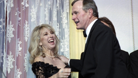 FILE - Actress Teri Garr is all smiles after being kissed by President Bush during a fundraising gala for the historic Ford's Theater in Washington, on March 20, 1991. (AP Photo/Ron Edmonds, File)