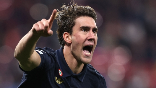 Juventus' Serbian forward #09 Dusan Vlahovic celebrates scoring his team's first goal during the UEFA Champions League football match between RB Leipzig and Juventus FC at the Red Bull Arena in Leipzig on October 2, 2024. (Photo by Ronny HARTMANN / AFP)