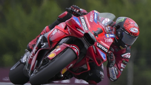 Italian rider Francesco Bagnaia of Ducati Lenovo Team, right, steers his motorcycle during the qualifying for the MotoGP Malaysian Grand Prix at the Sepang International Circuit in Sepang, outskirts of Kuala Lumpur, Saturday, Nov. 2, 2024. (AP Photo/Vincent Thian)