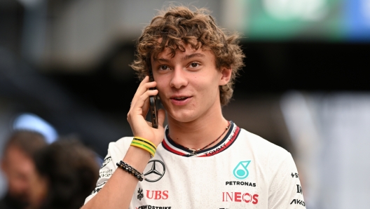 SAO PAULO, BRAZIL - OCTOBER 31: Andrea Kimi Antonelli of Italy and Mercedes talks on the phone in the Pitlane during previews ahead of the F1 Grand Prix of Brazil at Autodromo Jose Carlos Pace on October 31, 2024 in Sao Paulo, Brazil. (Photo by Clive Mason/Getty Images)