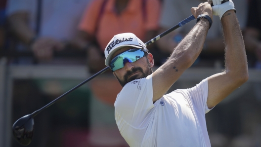 Francesco Laporta of Italy tees off at the 1st hole during the third round of Abu Dhabi Golf Championship in Abu Dhabi, United Arab Emirates, Saturday, Nov. 9, 2024. (AP Photo/Altaf Qadri)