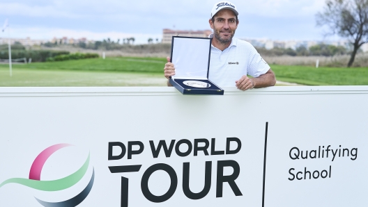 TARRAGONA, SPAIN - NOVEMBER 14: Edoardo Molinari of Italy pose with the trophy after winning the DP World Tour Qualifying School during day six of the final stage of DP World Tour Qualifying School at Lakes Course, Infinitum on November 14, 2024 in Tarragona, . (Photo by Aitor Alcalde/Getty Images)