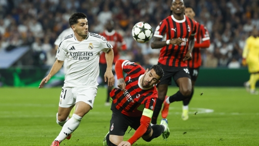 epa11703840 Real Madrid's Brahim Diaz (L) in action against AC Milan's Theo Hernandez (R) during the UEFA Champions League soccer match between Real Madrid and AC Milan, in Madrid, Spain, 05 November 2024.  EPA/Juanjo MartÃ­n