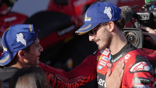 New world champion Ducati Spanish rider Jorge Martin (L) is congratulated by runner-up Ducati Italian rider Francesco Bagnaia after the MotoGP Solidarity Grand Prix of Barcelona at the Circuit de Catalunya on November 17, 2024 in Montmelo on the outskirts of Barcelona. Jorge Martin won the MotoGP world title after taking a 24-point lead into the final weekend of the season in Barcelona. (Photo by Manaure Quintero / AFP)