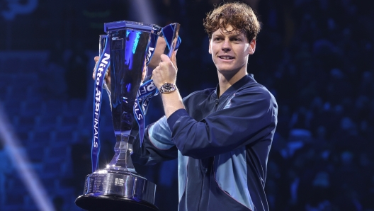 TURIN, ITALY - NOVEMBER 17: Jannik Sinner of Italy poses for a photo with the trophy after his victory against Taylor Fritz of United States during the Men's Singles final match on day eight of the Nitto ATP finals 2024 at Inalpi Arena on November 17, 2024 in Turin, Italy.  (Photo by Clive Brunskill/Getty Images)