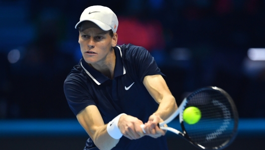 TURIN, ITALY - NOVEMBER 14: Jannik Sinner of Italy plays a backhand against Daniil Medvedev in the Men?s Singles Ilie Nastase Group stage match  during day five of the Nitto ATP finals 2024 at Inalpi Arena on November 14, 2024 in Turin, Italy. (Photo by Valerio Pennicino/Getty Images)