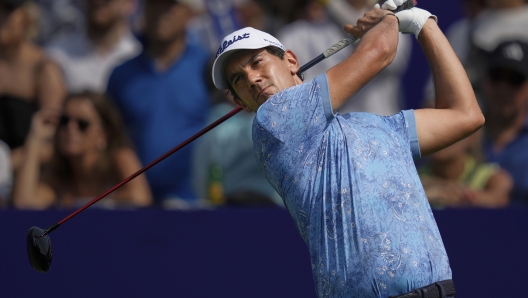 Matteo Manassero of Italy hits off the first tee during the first round of World Tour Golf Championship in Dubai, United Arab Emirates, Thursday, Nov. 14, 2024. (AP Photo/Altaf Qadri)