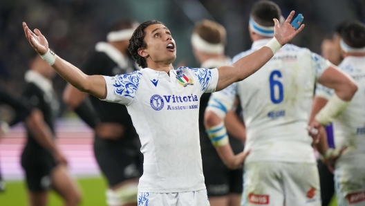 Italy's Ange Capuozzo reacts during the Autumn Nations Series rugby union match between Italy and the All Blacks at the Allianz stadium, in Turin, Italy, Saturday, Nov. 23, 2024. (AP Photo/Luca Bruno)