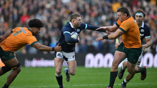 Scotland's fly-half Finn Russell (C) makes a break during the Autumn Nations Series International rugby union test match between Scotland and Australia at Murrayfield Stadium in Edinburgh on November 24, 2024. (Photo by ANDY BUCHANAN / AFP)