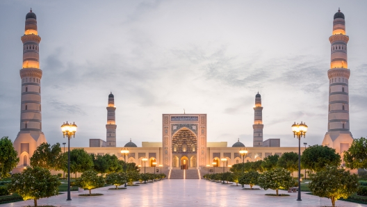 The Spectacular Sultan Qaboos Mosque in the city of Sohar with its marble floor and lights in perfect symmetry after sunset, in the country of Oman in the middle east.