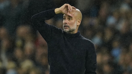 Manchester City's head coach Pep Guardiola gestures during the English Premier League soccer match between Manchester City and Tottenham at the Etihad Stadium in Manchester, England, Sunday, Nov. 24, 2024. (AP Photo/Dave Thompson)