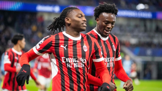 AC Milan's English forward #90 Tammy Abraham and AC Milan's Portuguese forward #10 Rafael Leao celebrate a goal during the UEFA Champions League football match SK Slovan Bratislava vs AC Milan in Bratislava, Slovakia on November 26, 2024. (Photo by -STR / AFP)