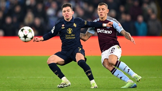 BIRMINGHAM, ENGLAND - NOVEMBER 27: Francisco Conceicao of Juventus is challenged by Lucas Digne of Aston Villa during the UEFA Champions League 2024/25 League Phase MD5 match between Aston Villa FC and Juventus at Villa Park on November 27, 2024 in Birmingham, England. (Photo by Shaun Botterill/Getty Images)