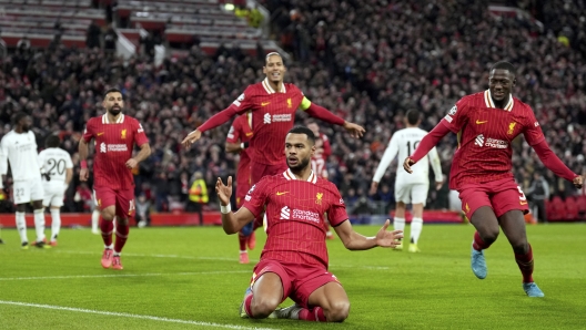 Liverpool's Cody Gakpo celebrates after scoring his side's second goal during the Champions League opening phase soccer match between Liverpool and Real Madrid at Anfield Stadium, Liverpool, England, Wednesday, Nov. 27, 2024. (AP Photo/Jon Super)