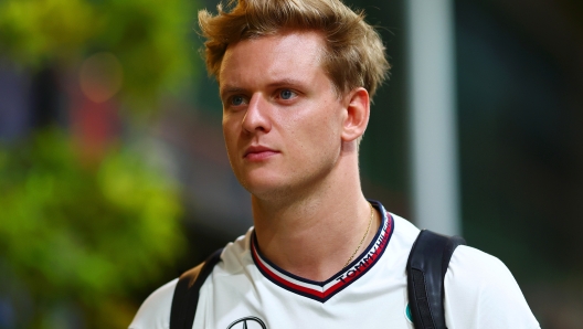 SINGAPORE, SINGAPORE - SEPTEMBER 19: Mick Schumacher of Germany, Reserve Driver of Mercedes walks in the Paddock during previews ahead of F1 Academy Round 5 at Marina Bay Street Circuit on September 19, 2024 in Singapore, Singapore. (Photo by Joe Portlock/Getty Images)