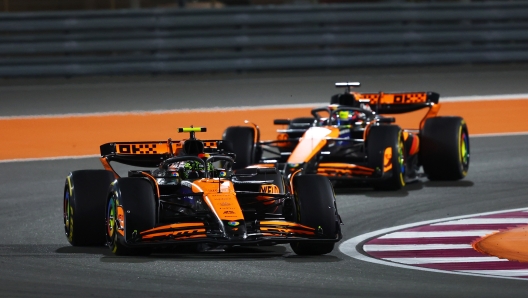 LUSAIL CITY, QATAR - NOVEMBER 30: Lando Norris of Great Britain driving the (4) McLaren MCL38 Mercedes leads Oscar Piastri of Australia driving the (81) McLaren MCL38 Mercedes during the Sprint ahead of the F1 Grand Prix of Qatar at Lusail International Circuit on November 30, 2024 in Lusail City, Qatar. (Photo by Joe Portlock/Getty Images)