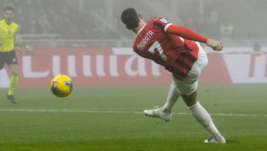 AC Milan's Alvaro Morata scores his side's opening goal during the Italian Serie A soccer match between AC Milan and Empoli, at the Milan San Siro stadium, Italy, Saturday, Nov. 30, 2024. (AP Photo/Luca Bruno)