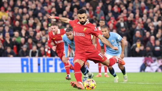 epa11752114 Mohamed Salah of Liverpool scores the 2-0 goal during the English Premier League match between Liverpool and Manchester City in Liverpool, Britain, 01 December 2024.  EPA/ADAM VAUGHAN EDITORIAL USE ONLY. No use with unauthorized audio, video, data, fixture lists, club/league logos, 'live' services or NFTs. Online in-match use limited to 120 images, no video emulation. No use in betting, games or single club/league/player publications.