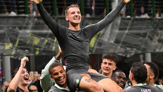 AC Milan's forward Francesco Camarda (C) celebrates after scoring during the UEFA Champions League match between AC Milan and Club Brugge KV at the Giuseppe Meazza Stadium in Milan, Italy, 22 October 2024. ANSA/DANIEL DAL ZENNARO