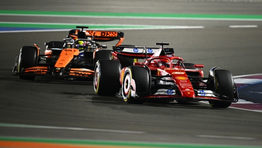 LUSAIL CITY, QATAR - DECEMBER 01: Charles Leclerc of Monaco driving the (16) Ferrari SF-24 leads Oscar Piastri of Australia driving the (81) McLaren MCL38 Mercedes on track during the F1 Grand Prix of Qatar at Lusail International Circuit on December 01, 2024 in Lusail City, Qatar. (Photo by Clive Mason/Getty Images)