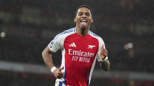 Arsenal's Jurrien Timber celebrates after scoring his side's first goal during the English Premier League soccer match between Arsenal and Manchester United at Emirates stadium in London, Wednesday, Dec. 4, 2024. (AP Photo/Kirsty Wigglesworth)