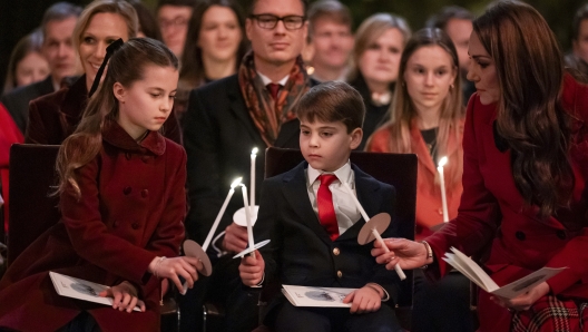 Britain's Princess Charlotte, from left, Prince Louis and Kate, the Princess of Wales, during the Together At Christmas carol service at Westminster Abbey, in London, Friday, Dec. 6, 2024. (Aaron Chown/Pool Photo via AP)